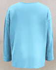 Olivira - Løs top med blomstermønster inspireret af naturen