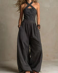 Fiorenzae - Feminin jumpsuit i flydende stof med krydset overdel og elegante vide ben