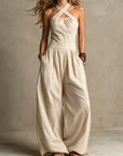 Fiorenzae - Feminin jumpsuit i flydende stof med krydset overdel og elegante vide ben