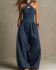 Fiorenzae - Feminin jumpsuit i flydende stof med krydset overdel og elegante vide ben