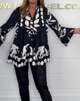 Alix - Elegant bluse med udsvingende ærmer og V-hals