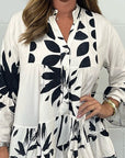 Alix - Elegant bluse med udsvingende ærmer og V-hals